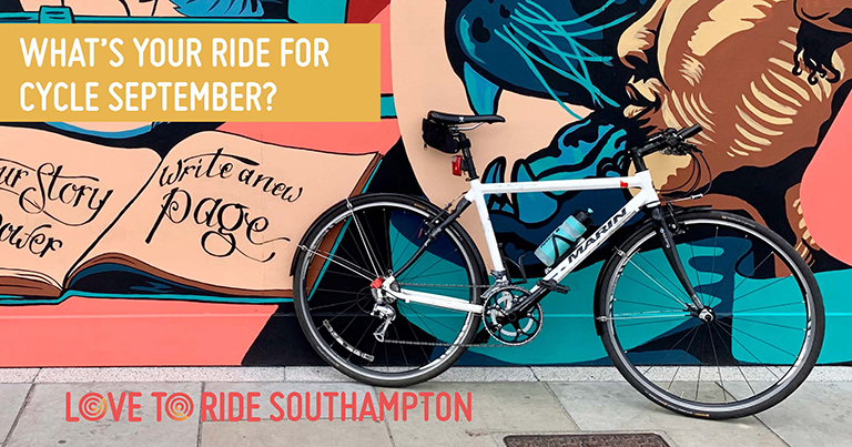 A bike propped up against a wall covered in a large colourful mural which contains images of faces, a key, and an open book containing the words ‘your story your power, write a new page’. The text on the asset says ‘what’s your ride for Cycle September?’. A bike propped up against a wall covered in a large colourful mural which contains images of faces, a key, and an open book containing the words ‘your story your power, write a new page’. The text on the asset says ‘what’s your ride for Cycle September?’.