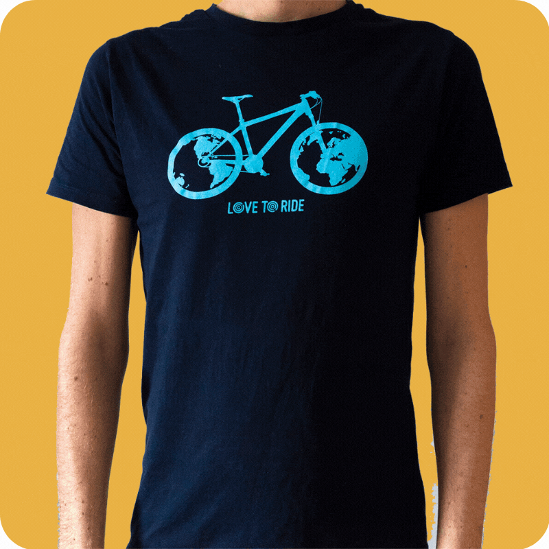A dark blue T-shirt with a light blue bike design on the front. The image has animated sparkles at the edges. The bike design is a blue bike with an Earth design inside the wheels. The Love to Ride logo is displayed underneath the bike. A dark blue T-shirt with a light blue bike design on the front. The image has animated sparkles at the edges. The bike design is a blue bike with an Earth design inside the wheels. The Love to Ride logo is displayed underneath the bike.