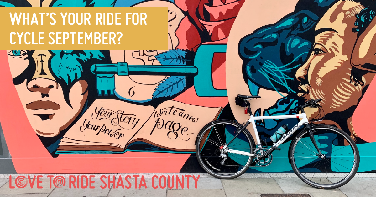 A bike propped up against a wall covered in a large colourful mural which contains images of faces, a key, and an open book containing the words ‘your story your power, write a new page’. The text on the asset says ‘what’s your ride for Cycle September?’. A bike propped up against a wall covered in a large colourful mural which contains images of faces, a key, and an open book containing the words ‘your story your power, write a new page’. The text on the asset says ‘what’s your ride for Cycle September?’.