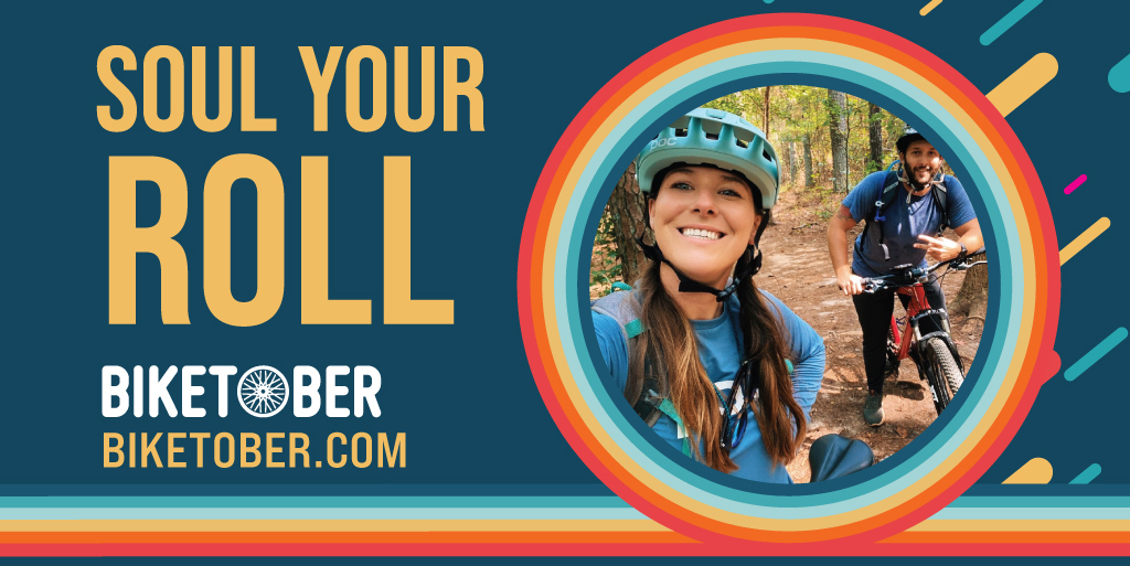 Rectangular graphic with text on the left and a photo of a smiling woman wearing a helmet. The text says "Soul your roll. biketober.com" Rectangular graphic with text on the left and a photo of a smiling woman wearing a helmet. The text says "Soul your roll. biketober.com"