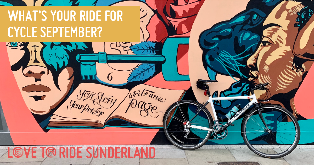 A bike propped up against a wall covered in a large colourful mural which contains images of faces, a key, and an open book containing the words ‘your story your power, write a new page’. The text on the asset says ‘what’s your ride for Cycle September?’. A bike propped up against a wall covered in a large colourful mural which contains images of faces, a key, and an open book containing the words ‘your story your power, write a new page’. The text on the asset says ‘what’s your ride for Cycle September?’.
