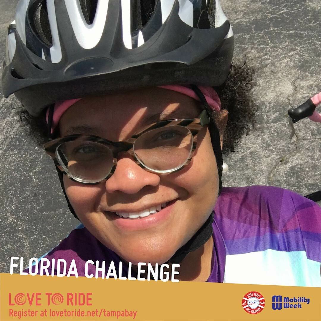 A selfie of a rider with her helmet on. The text says 'Florida Challenge' with the Love to Ride logo beneath and the Alert Today and Mobility Week logos at the bottom right corner. A selfie of a rider with her helmet on. The text says 'Florida Challenge' with the Love to Ride logo beneath and the Alert Today and Mobility Week logos at the bottom right corner.