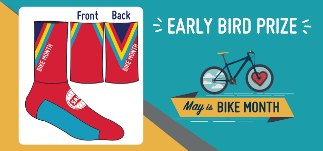 On the left, an illustration of a pair of red socks with turquoise bottoms and navy, turquoise and gold chevron on the back. The socks have a white SABA logo and say Bike Month On the left, an illustration of a pair of red socks with turquoise bottoms and navy, turquoise and gold chevron on the back. The socks have a white SABA logo and say Bike Month