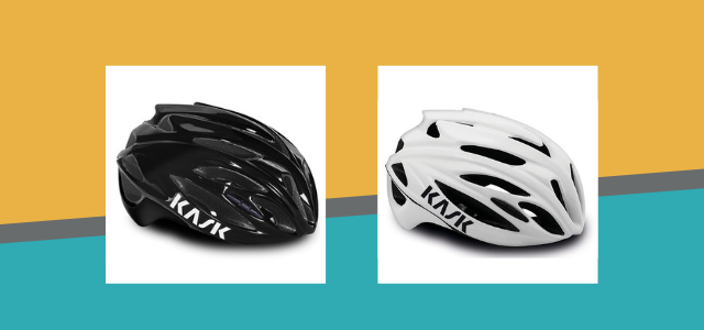Two helmets, one black and one white Two helmets, one black and one white