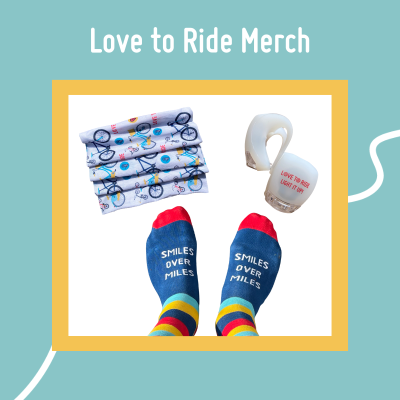 a snood, a set of bike lights and a pair of socks on feet over a white background. it's surrounded by a blue border with the text Love to Ride Merch a snood, a set of bike lights and a pair of socks on feet over a white background. it's surrounded by a blue border with the text Love to Ride Merch