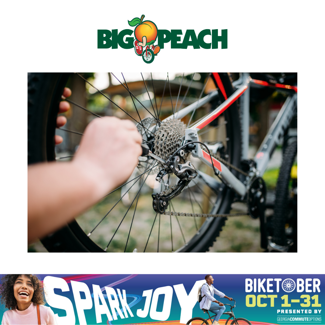 Image of the Big Peach logo on top of someone fixing a bike wheel. 