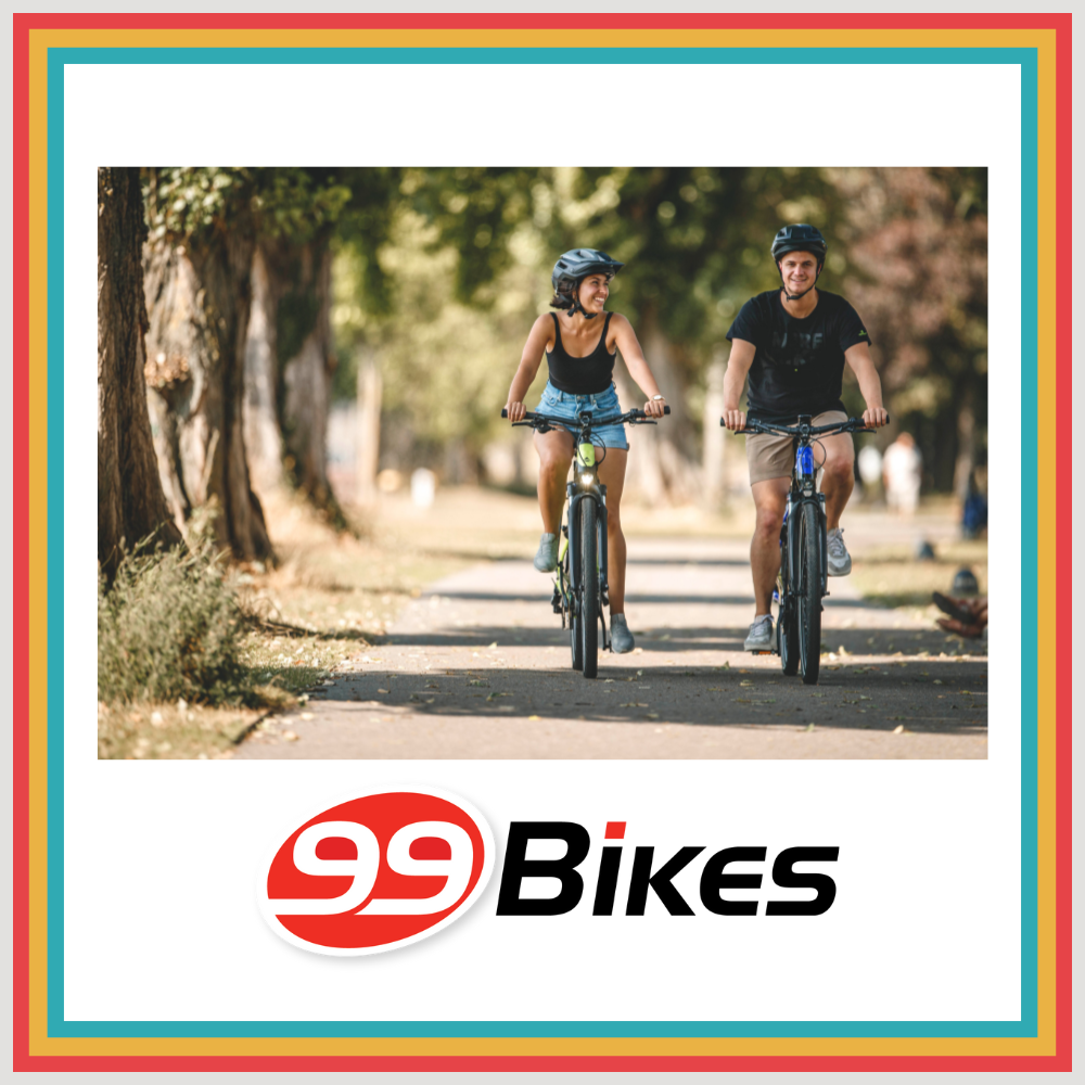 Image of two riders riding on a path and the 99 bikes logo is beneath them. 