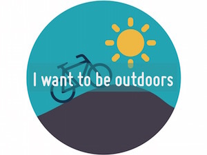 Circle containing illustration of a bike rolling up a hill with 'I want to be outdoors written on top'